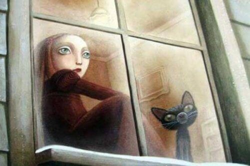 pencereden bakan kız ve kedi 