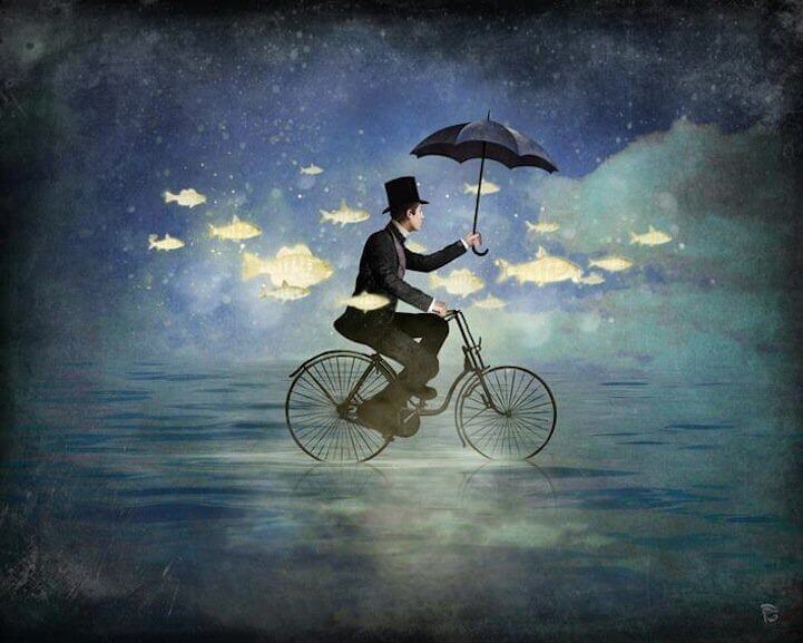 bisiklet süren şemsiyeli adam