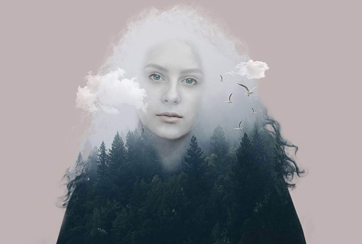 bulutlar ve ormanla sarılı bir kadın